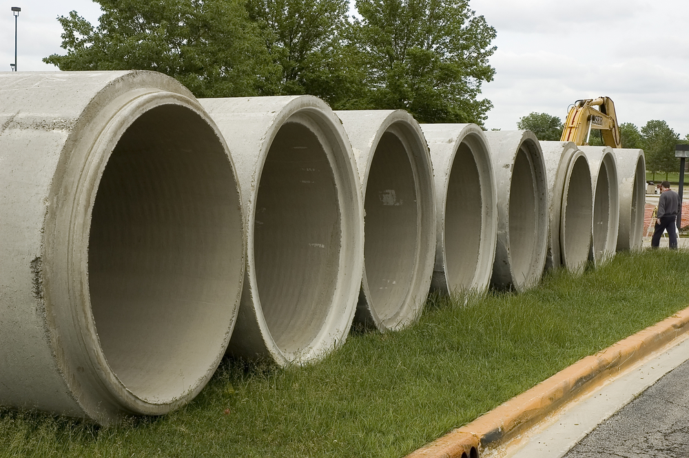 Row of concrete conduits on construction site Row of concrete conduits on construction site
